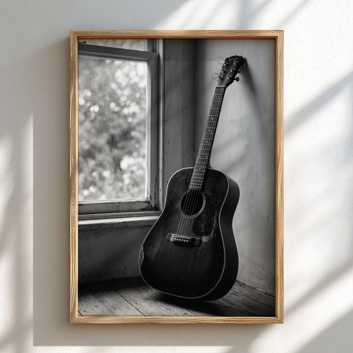 black and white acoustic guitar wall art with vintage rustic interior and soft natural window light
