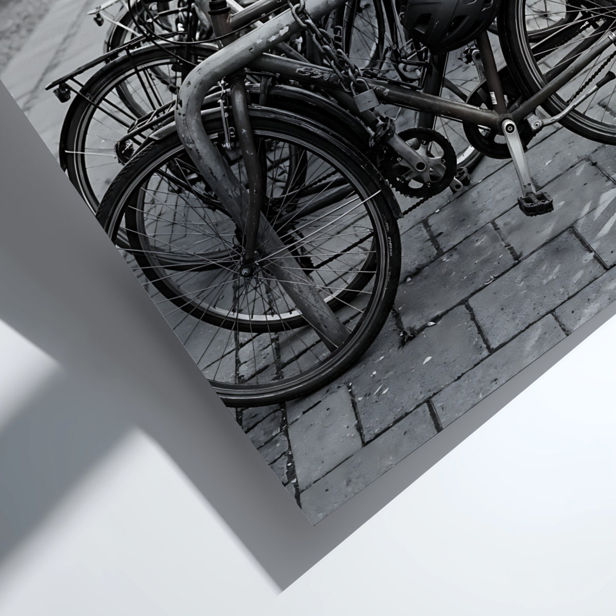 black and white wall decor showing bicycles parked at bike rack on cobblestone street with urban background