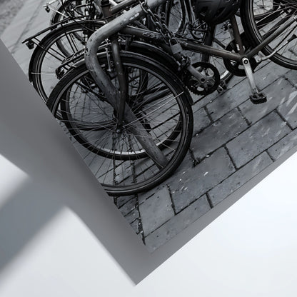 black and white wall decor showing bicycles parked at bike rack on cobblestone street with urban background