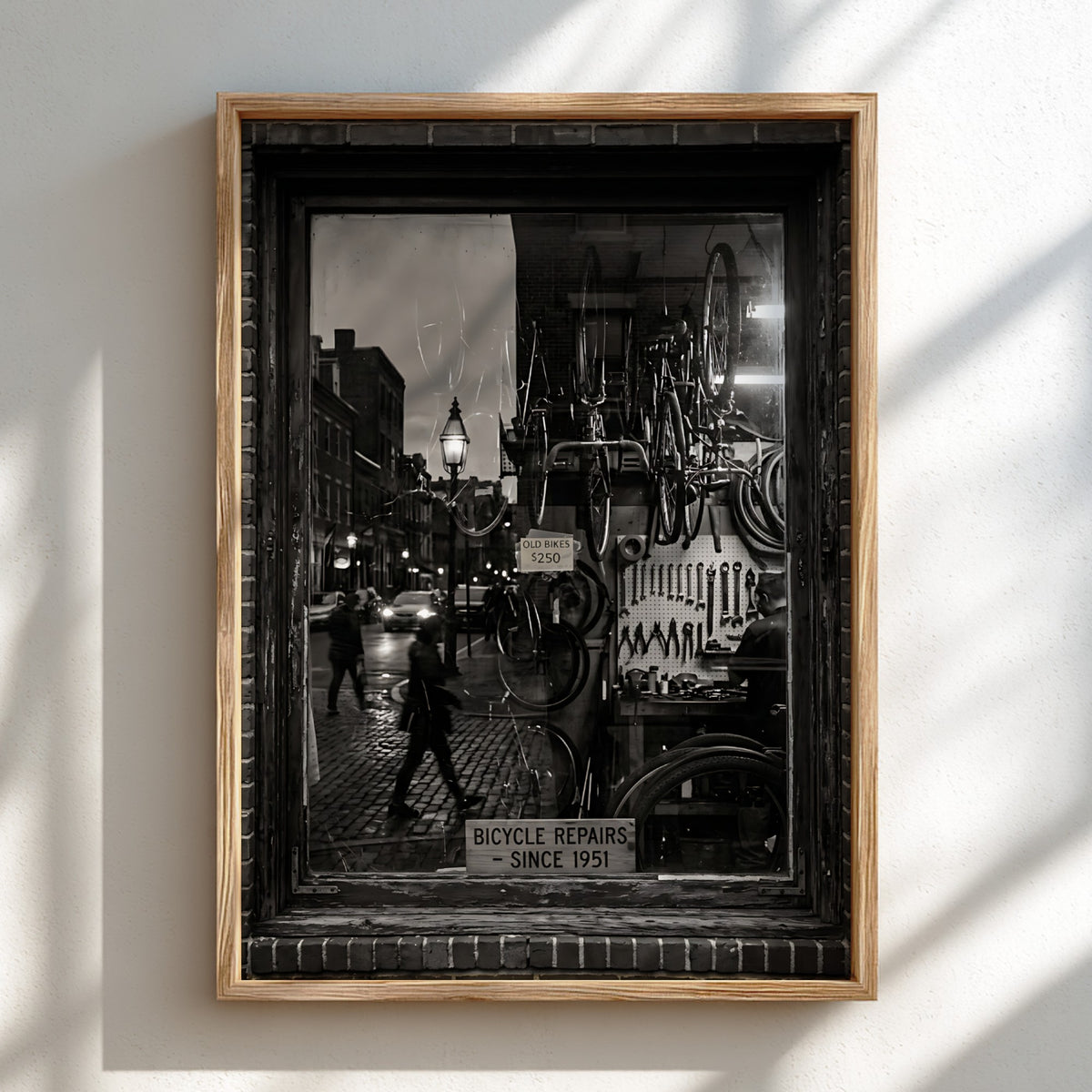 Black and white bicycle repairs shop poster with vintage bicycles and tools seen through window