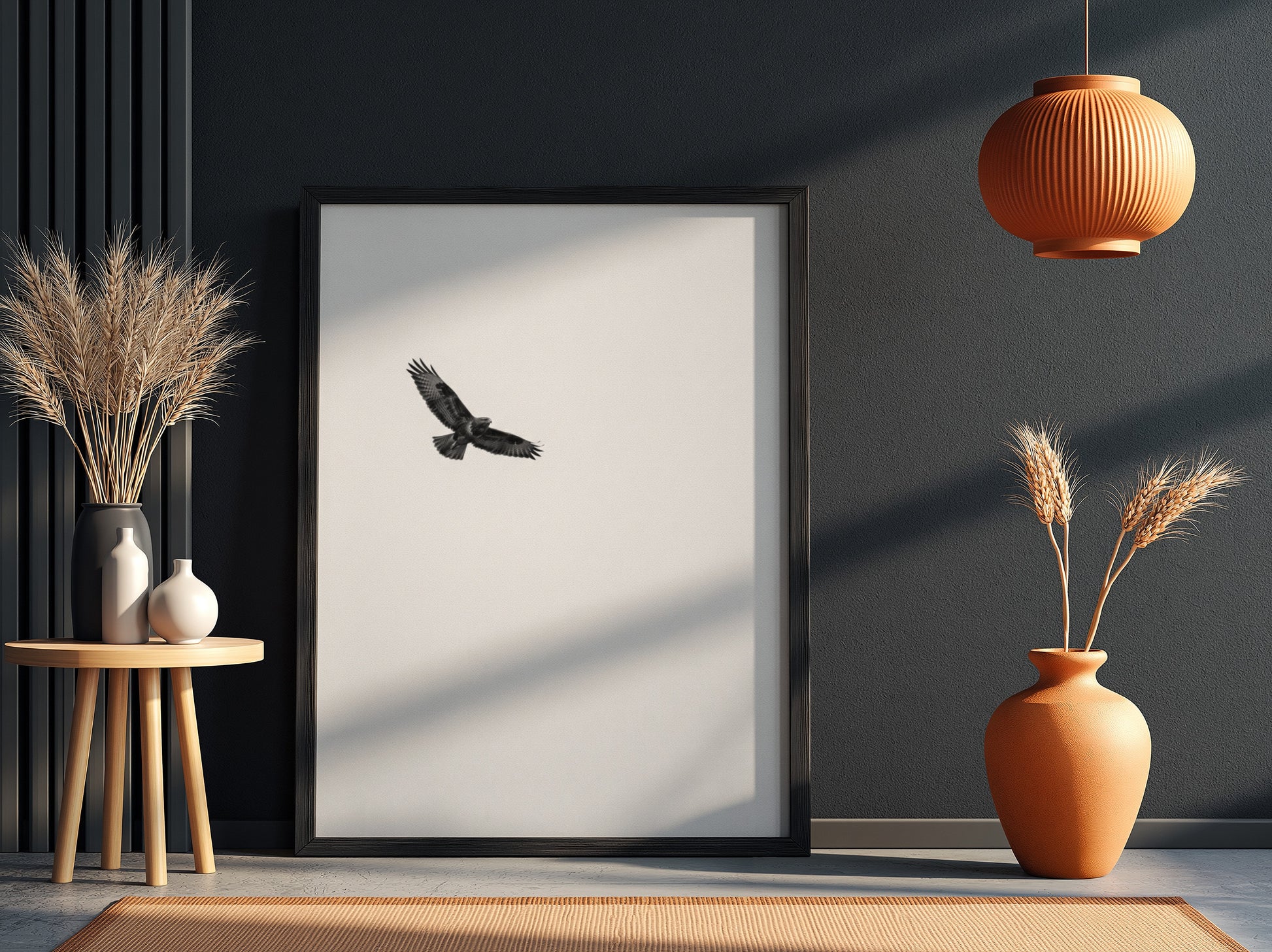 Framed wall decor featuring a black bird in flight against a pale sky with natural wood frame