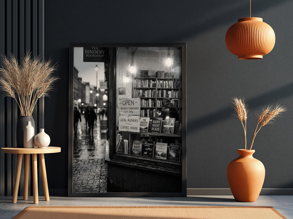 Black and white photographic wall decor showing a rainy evening bookshop window with books and reflections