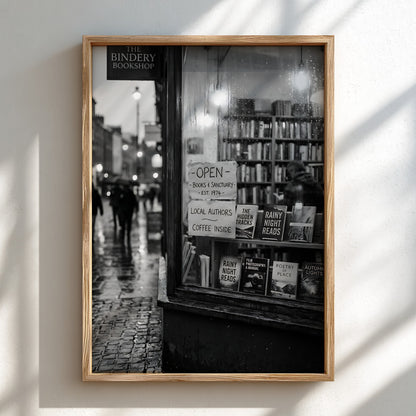 Black and white photographic wall decor showing a rainy evening bookshop window with books and reflections
