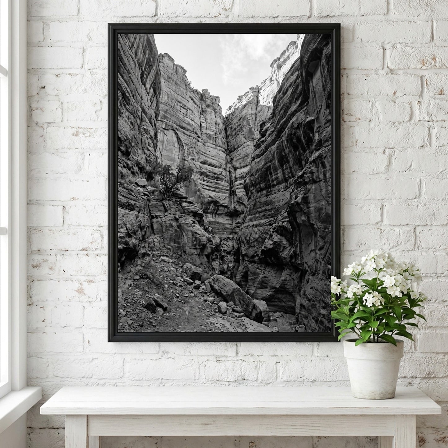 Black and white poster of canyon walls with layered sedimentary rock and rugged textures
