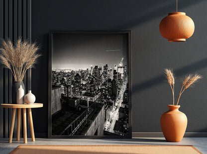 City skyline at night poster in black and white with glowing lights and tall buildings