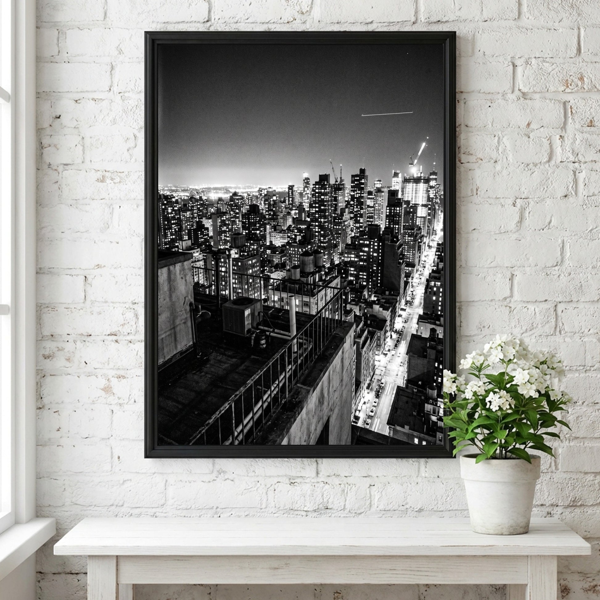 City skyline at night poster in black and white with glowing lights and tall buildings