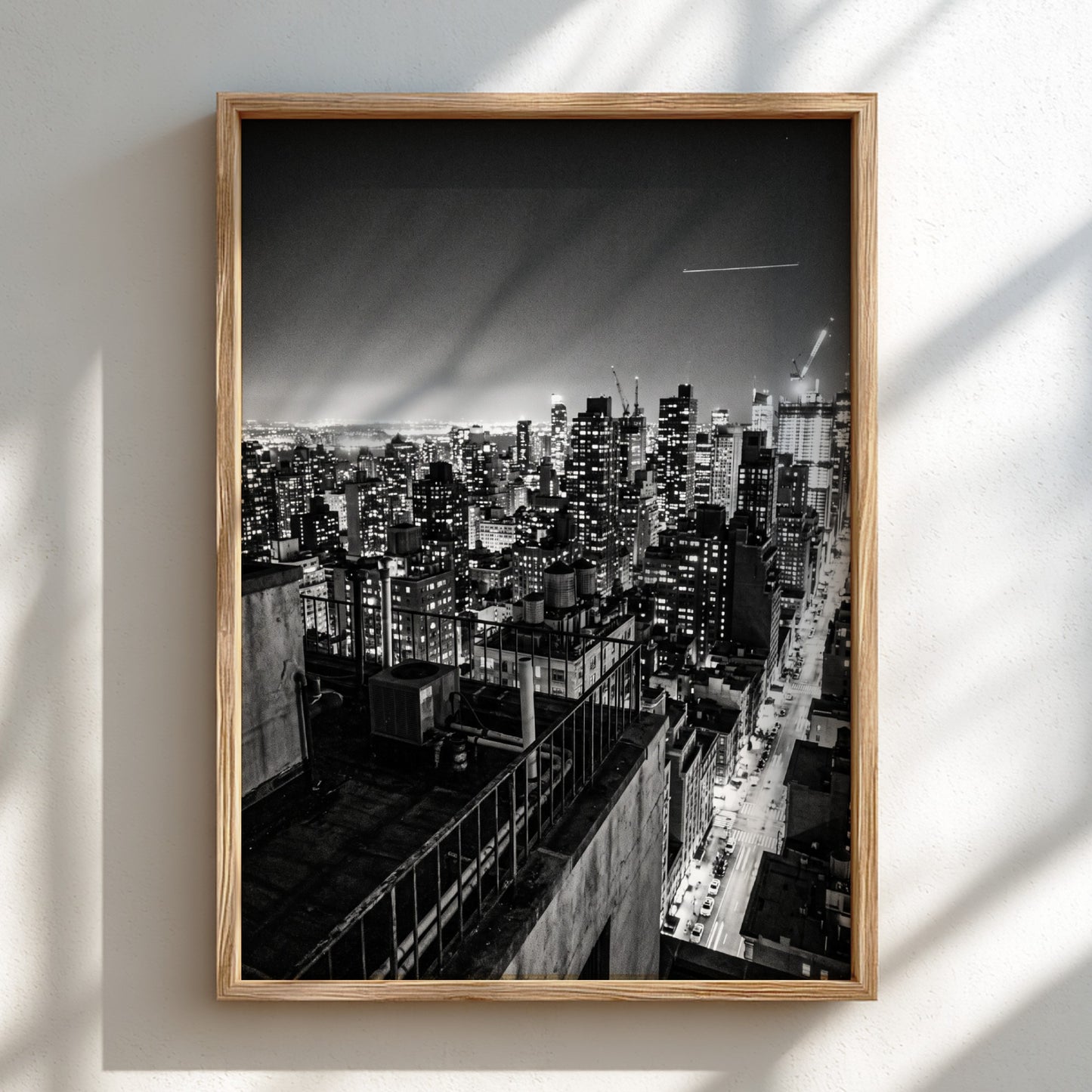 City skyline at night poster in black and white with glowing lights and tall buildings