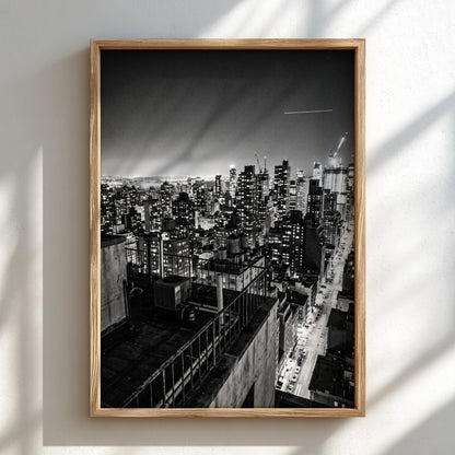 City skyline at night poster in black and white with glowing lights and tall buildings