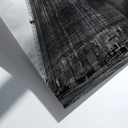 Black and white poster of industrial cooling towers with steam against cloudy sky