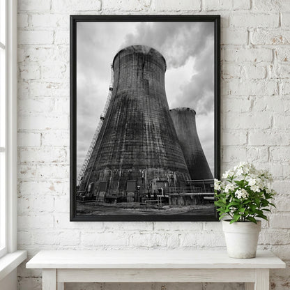 Black and white poster of industrial cooling towers with steam against cloudy sky
