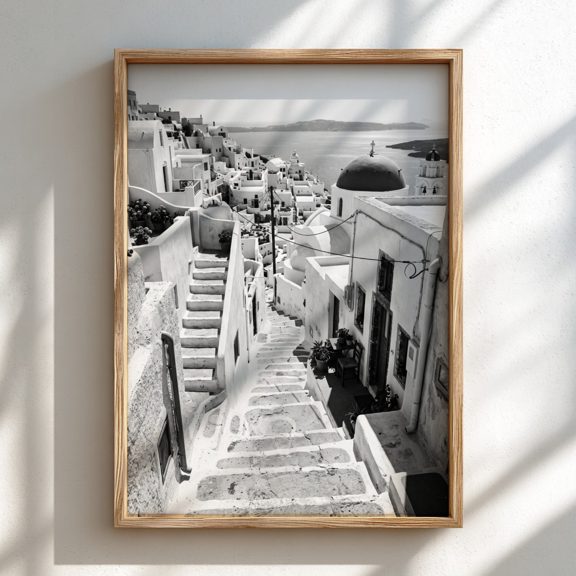 Framed black and white Cycladic steps winding between whitewashed buildings Mediterranean wall decor