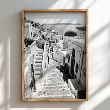 Framed black and white Cycladic steps winding between whitewashed buildings Mediterranean wall decor
