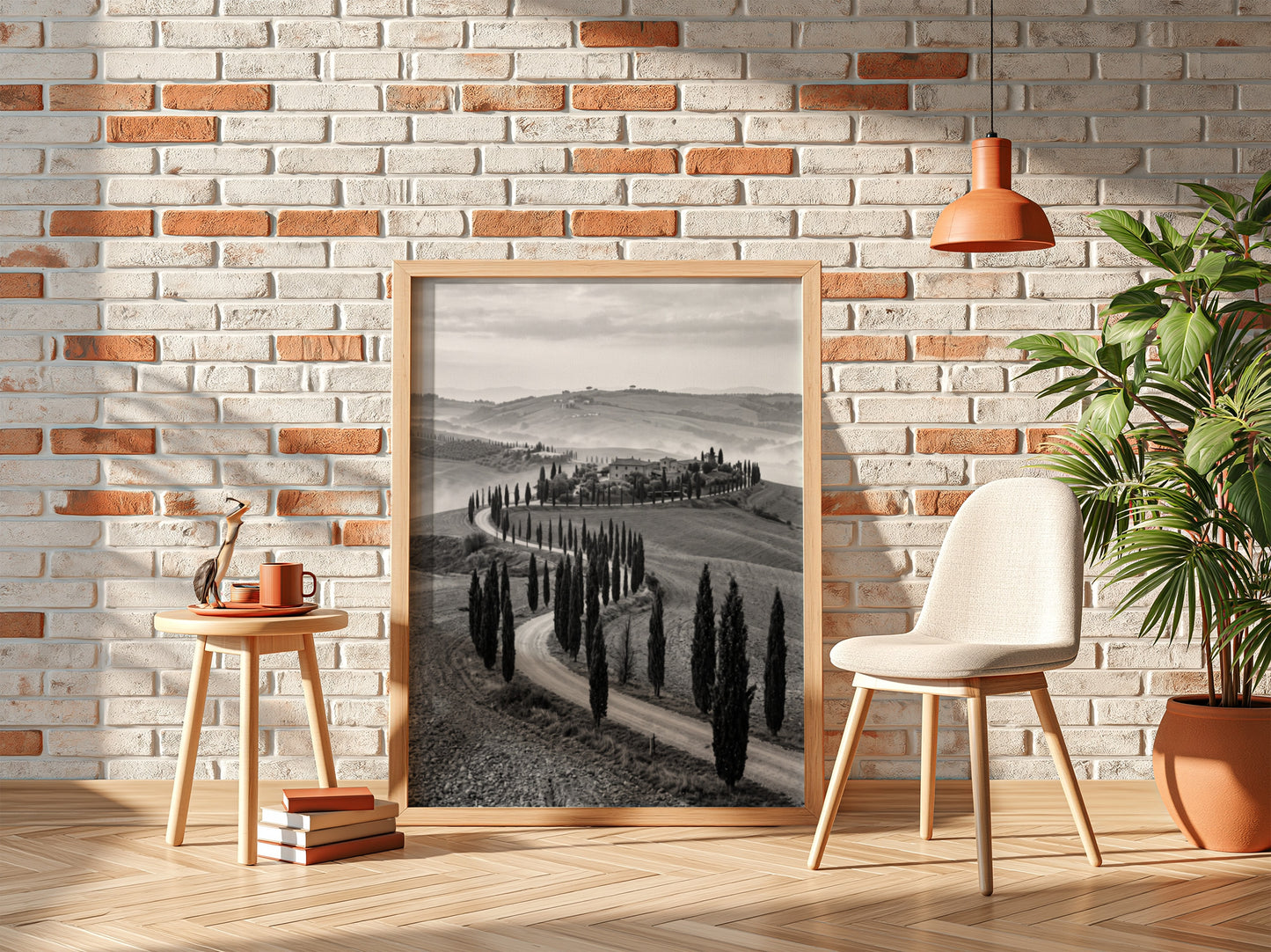 Black and white wall decor featuring tall cypress trees lining winding road on rolling hills