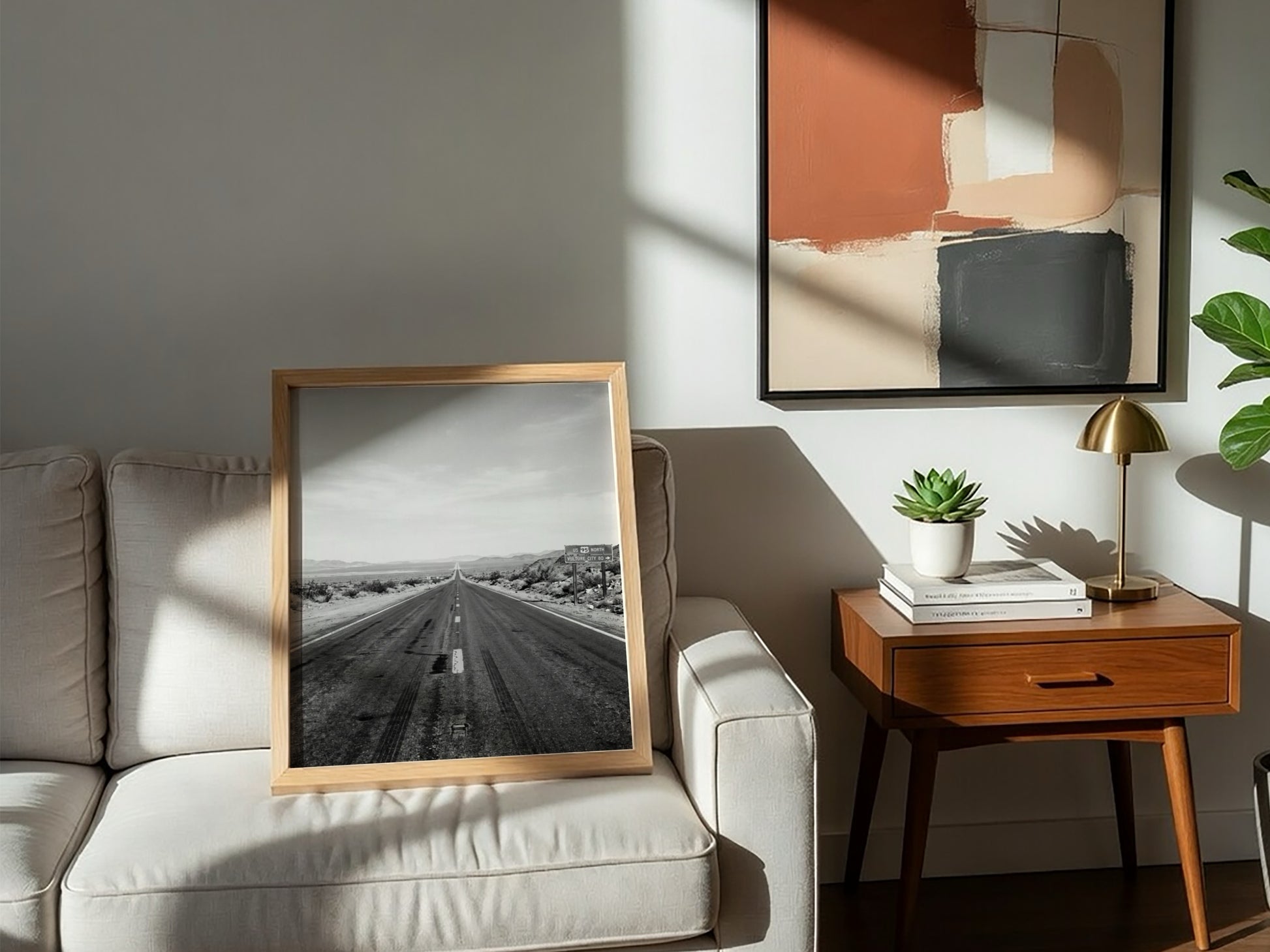 Wall poster of black and white desert highway stretching to horizon with mountains and open landscape