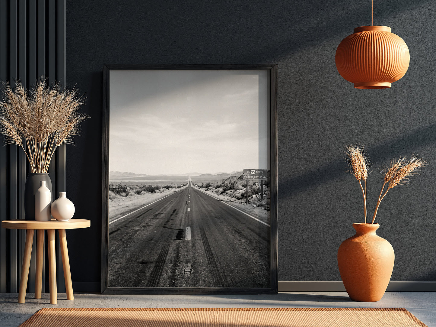Wall poster of black and white desert highway stretching to horizon with mountains and open landscape
