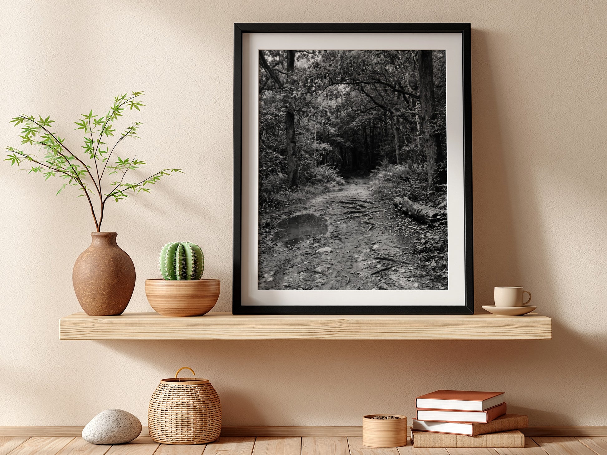 Black and white wall decor of dirt path through dense woodland with trees and roots