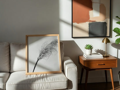 Wall decor featuring dried pampas grass with fine textures and muted soft grey background