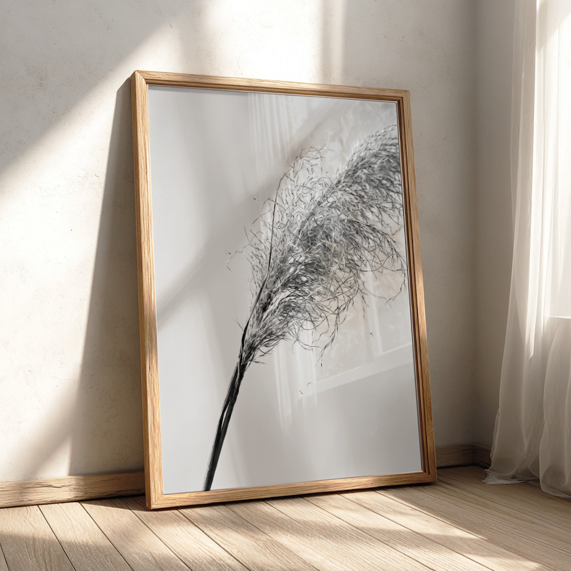 Wall decor featuring dried pampas grass with fine textures and muted soft grey background