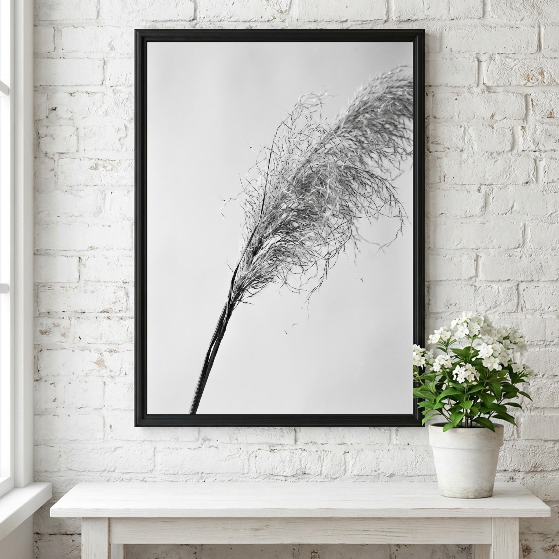 Wall decor featuring dried pampas grass with fine textures and muted soft grey background