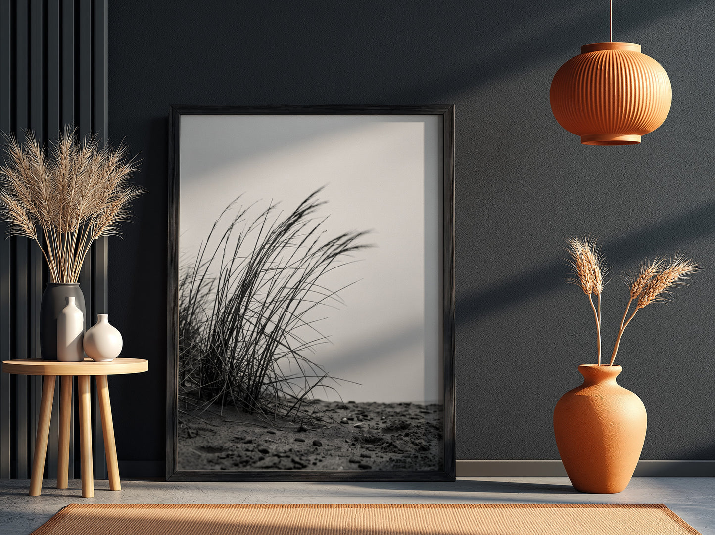 Black and white poster showing dune grass bending in wind on sandy ground with soft shadows
