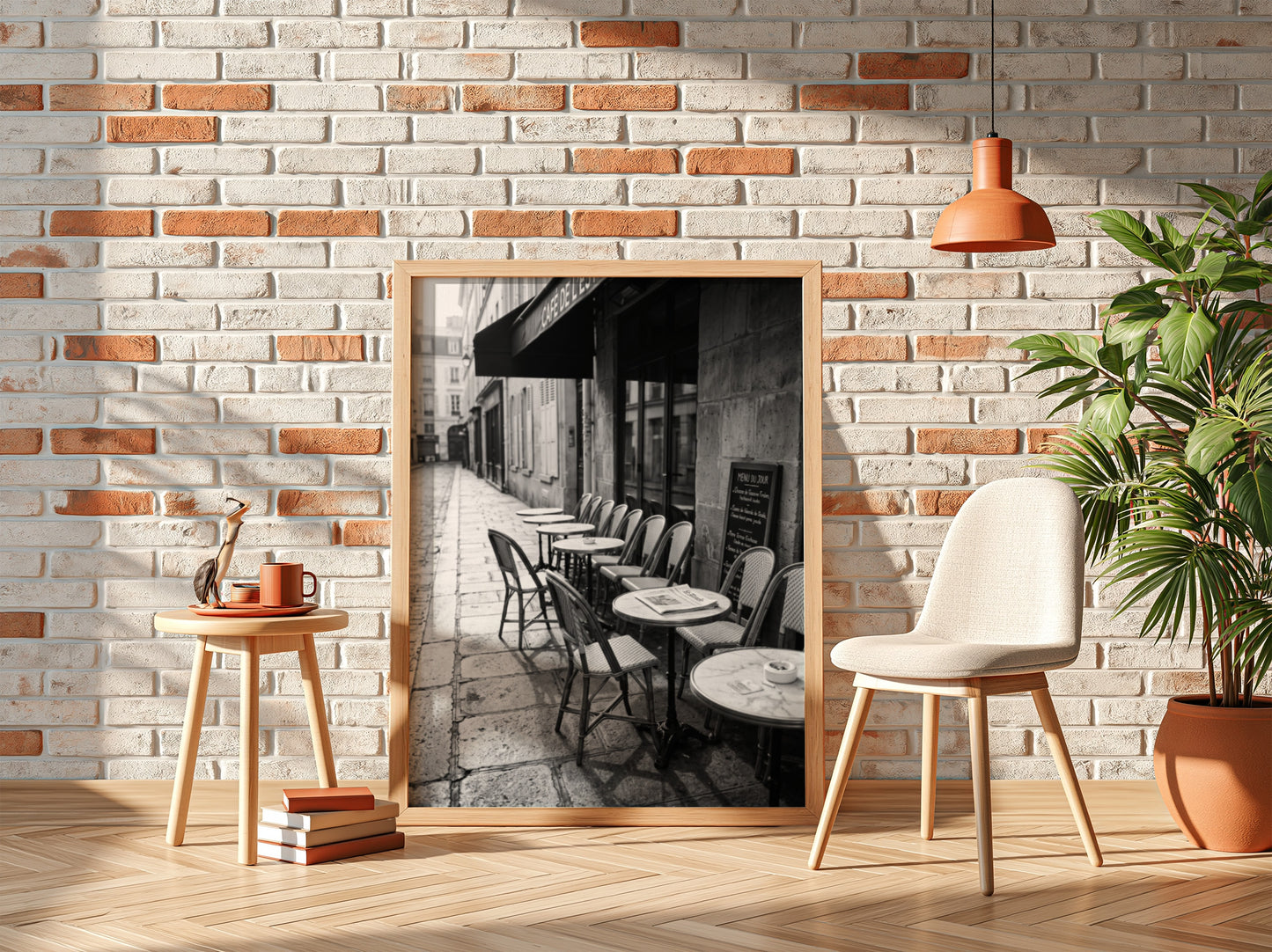 Black and white wall decor featuring empty Parisian cafe terrace with chairs and tables on cobblestone street