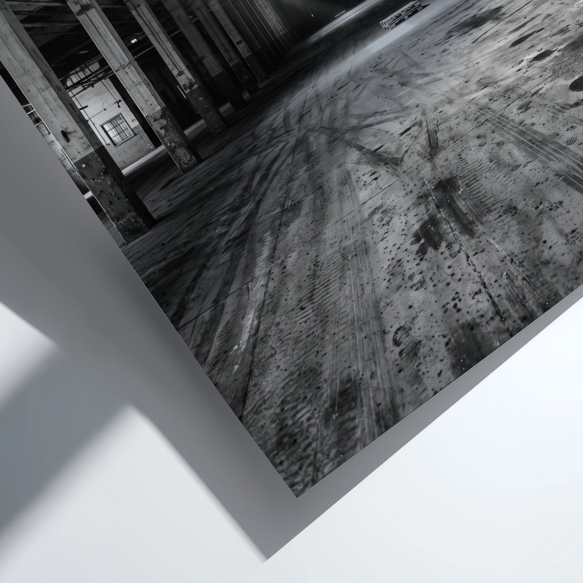 Poster of empty warehouse interior with monochrome tones and natural light beams