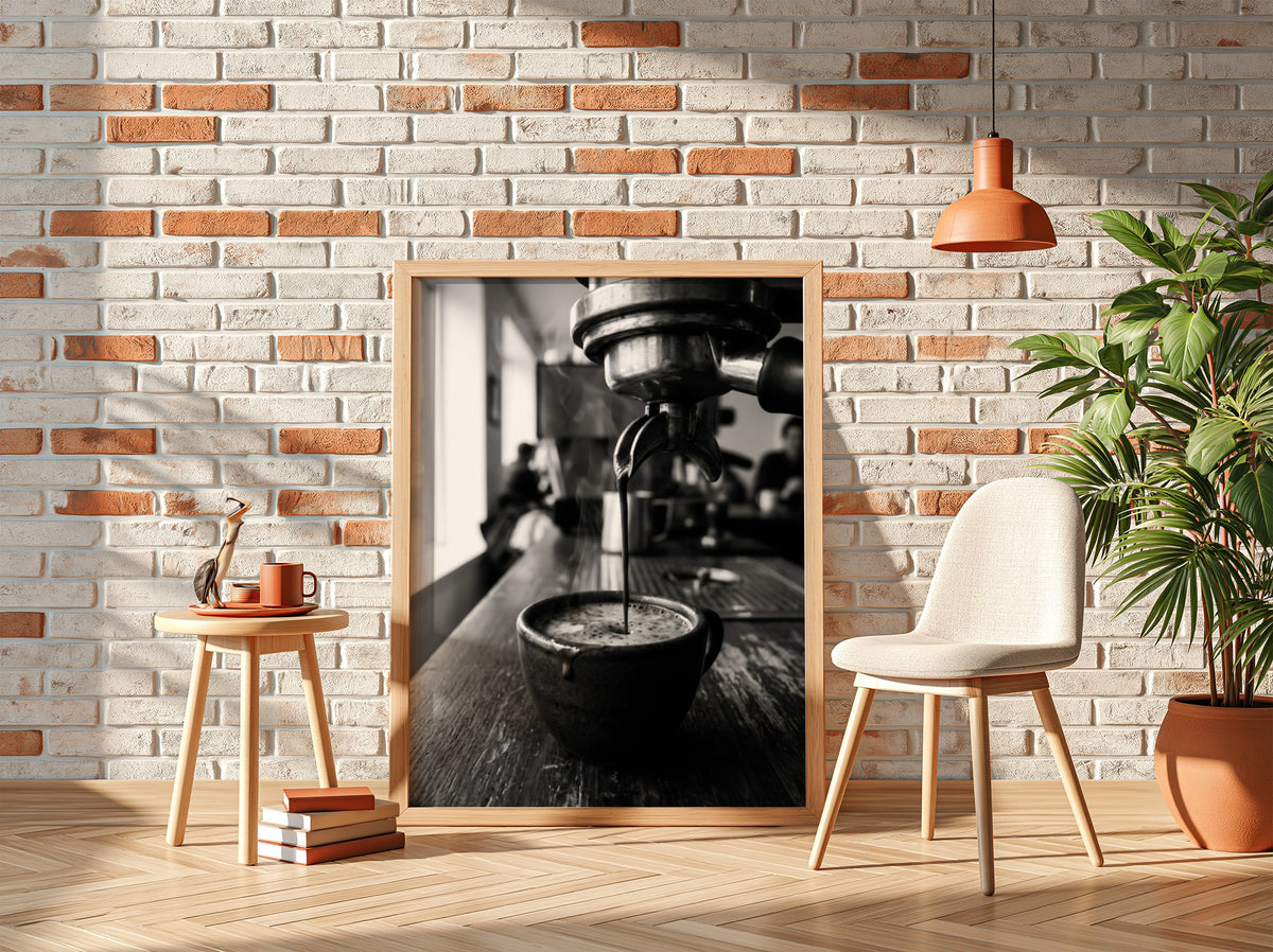 Black and white poster showing espresso pouring from coffee machine into cup on wooden surface