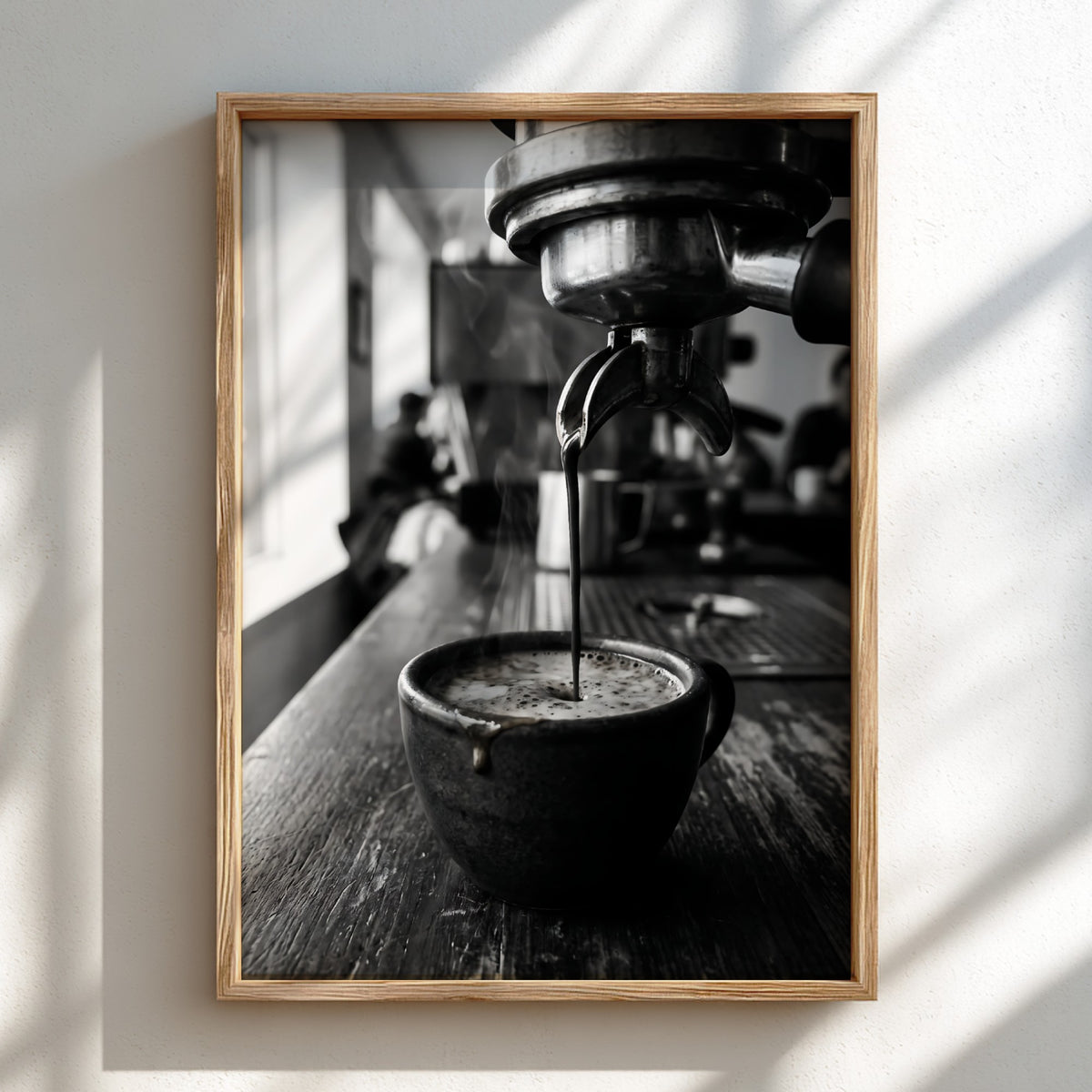 Black and white poster showing espresso pouring from coffee machine into cup on wooden surface