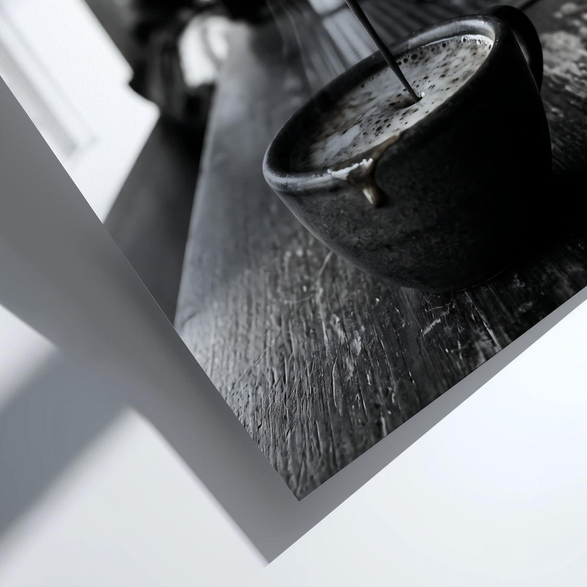 Black and white poster showing espresso pouring from coffee machine into cup on wooden surface