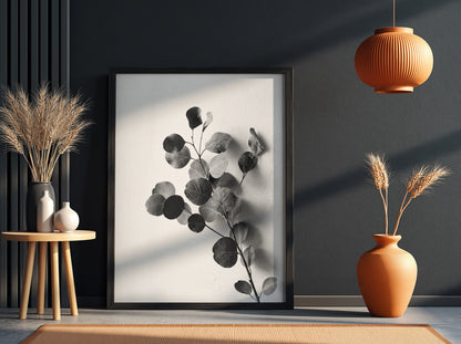 botanical wall decor featuring grayscale eucalyptus branch with rounded leaves on white background