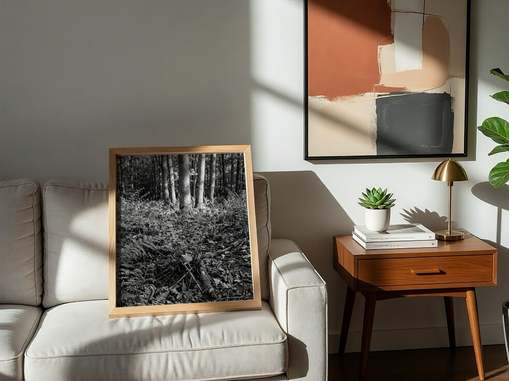 Black and white poster showing ferns on a forest floor with tree trunks and detailed foliage