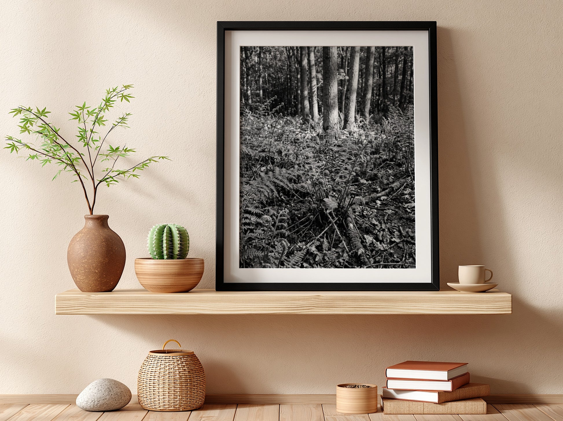 Black and white poster showing ferns on a forest floor with tree trunks and detailed foliage
