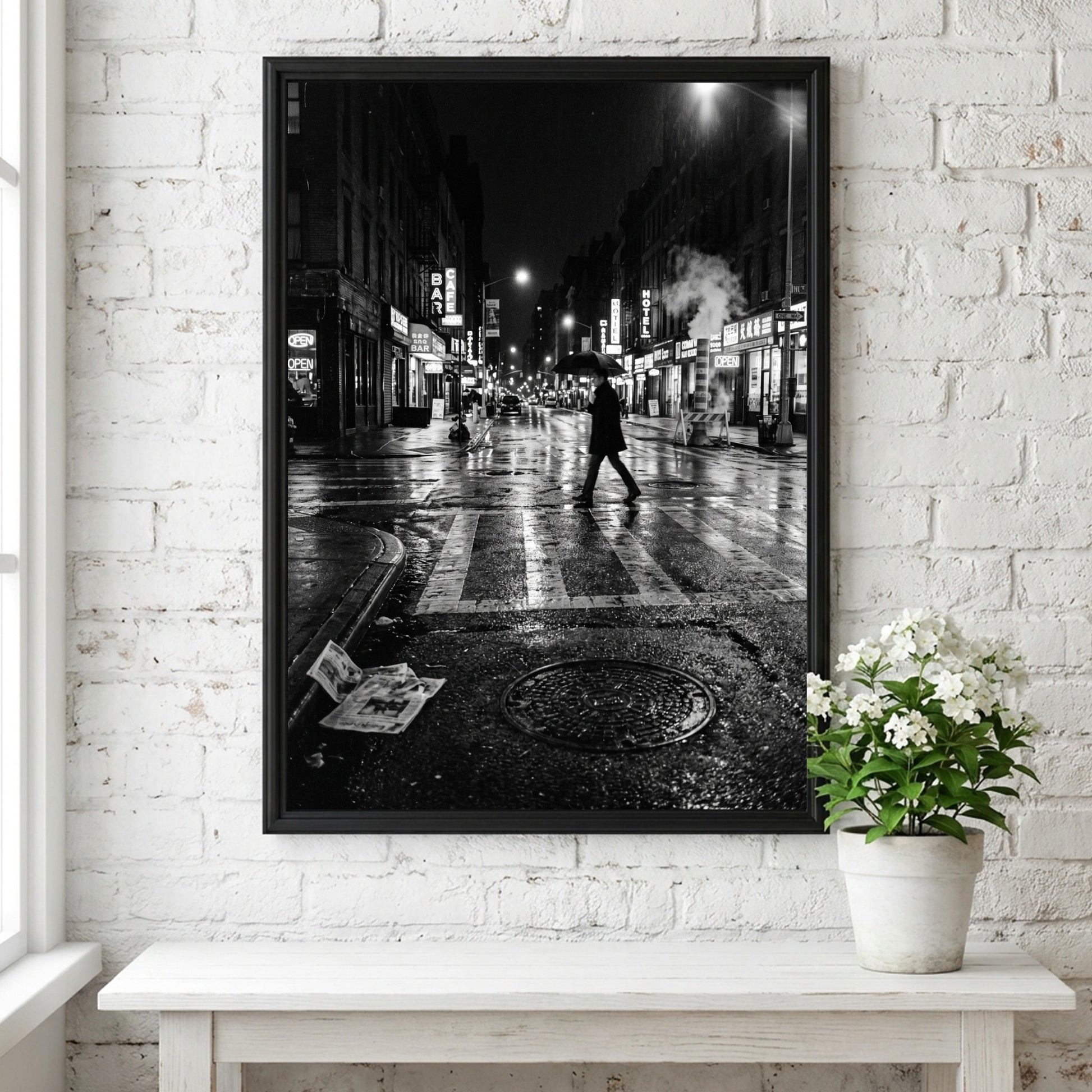 Black and white urban wall decor showing figure crossing wet street at night with reflective asphalt and