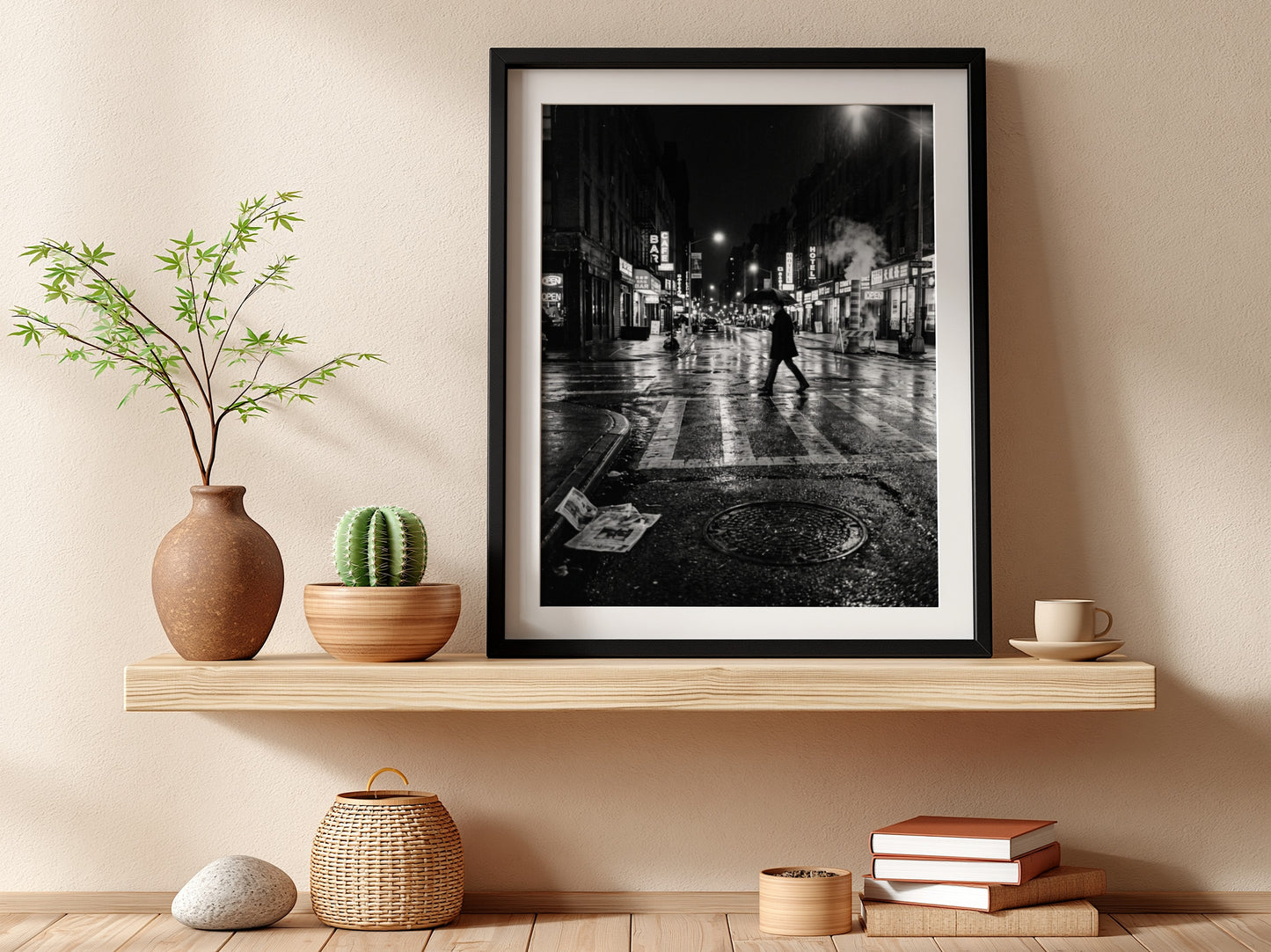 Black and white urban wall decor showing figure crossing wet street at night with reflective asphalt and