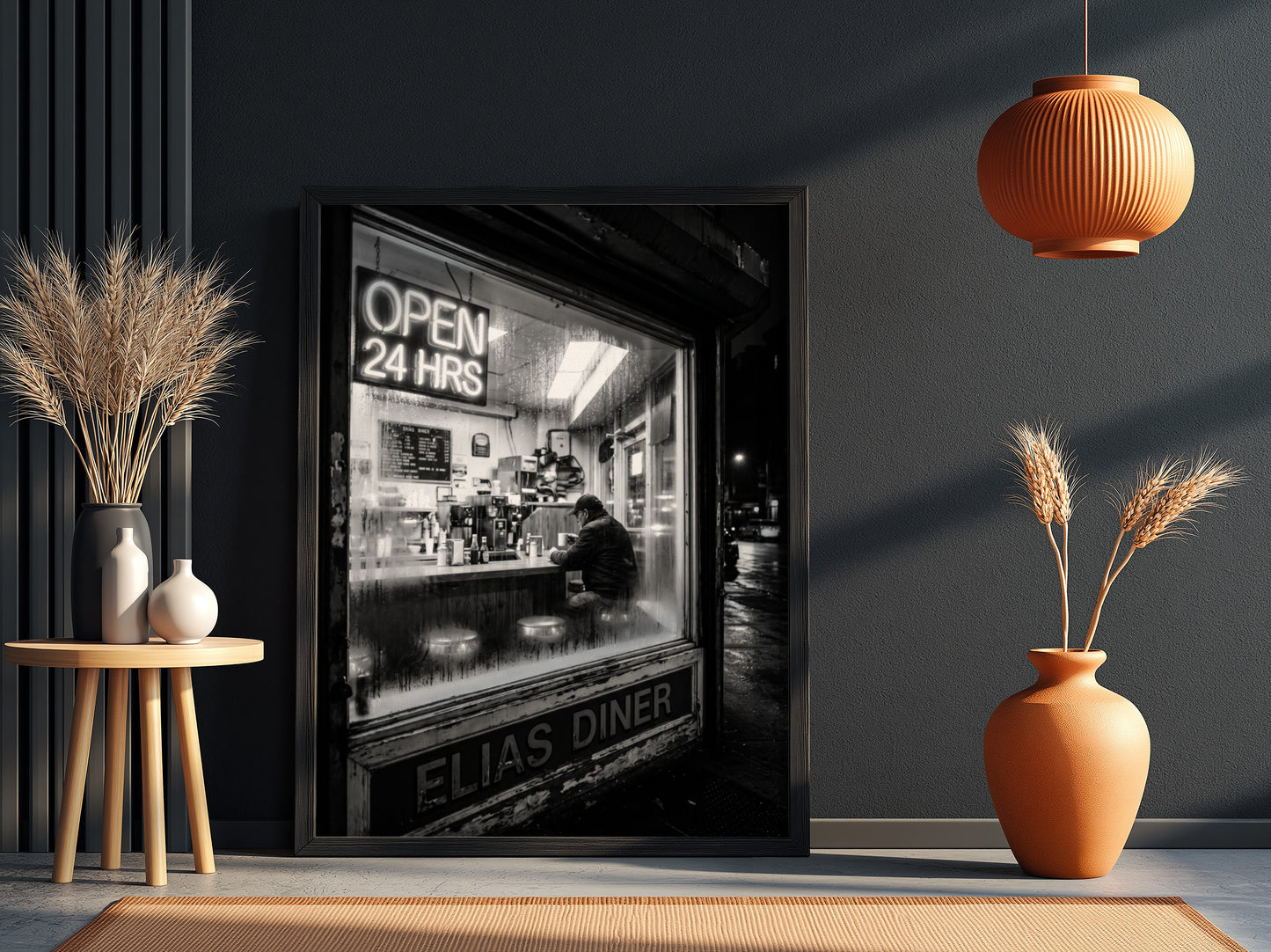 Poster of black and white diner interior with neon open 24 hrs sign and lone figure sitting