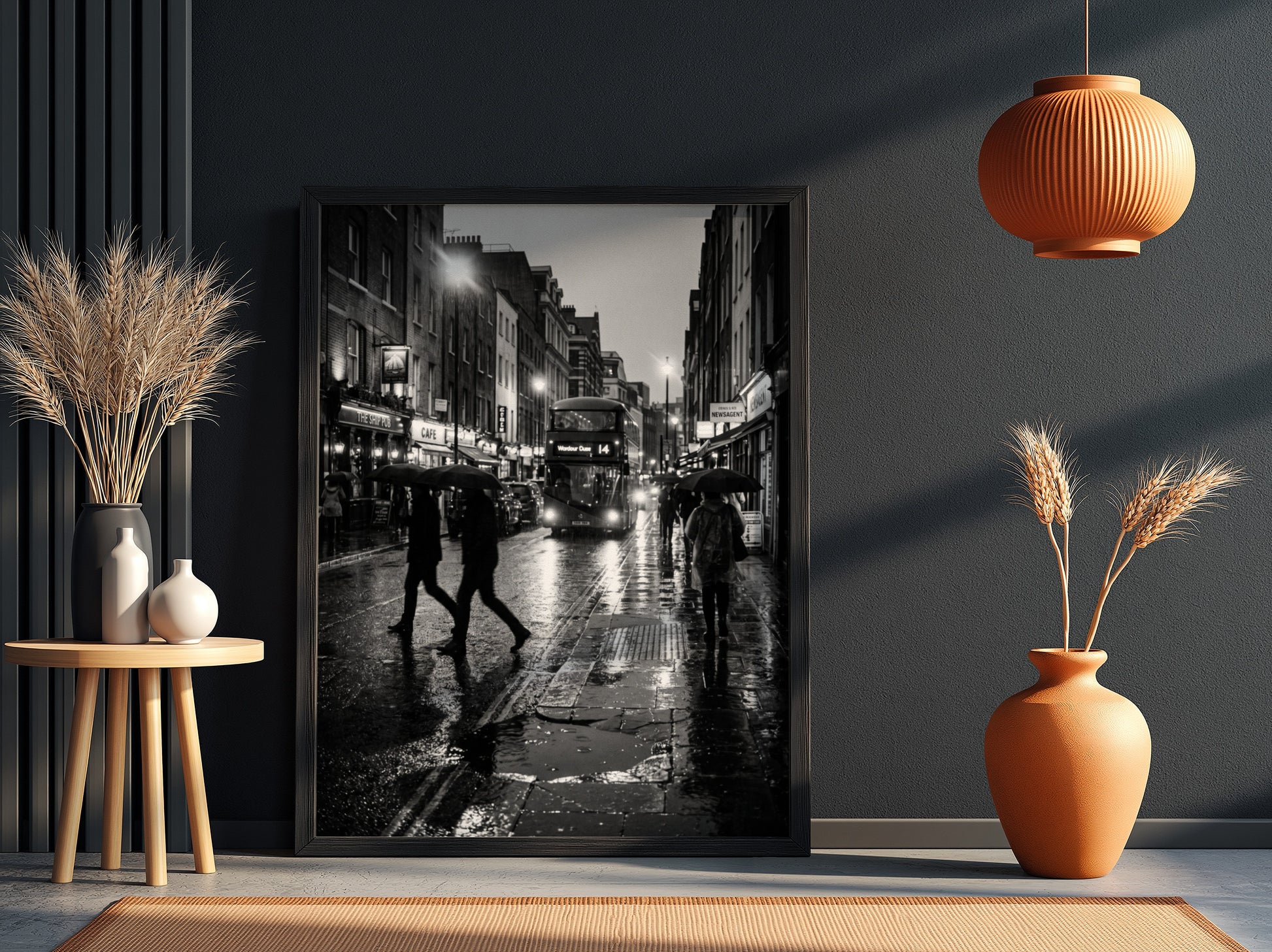 black and white wall decor showing figures walking on rainy city street with umbrellas and double-decker bus