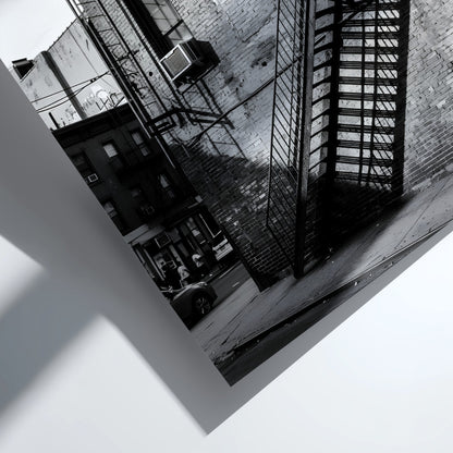 black and white wall decor showing fire escape stairs on brick building with shadows