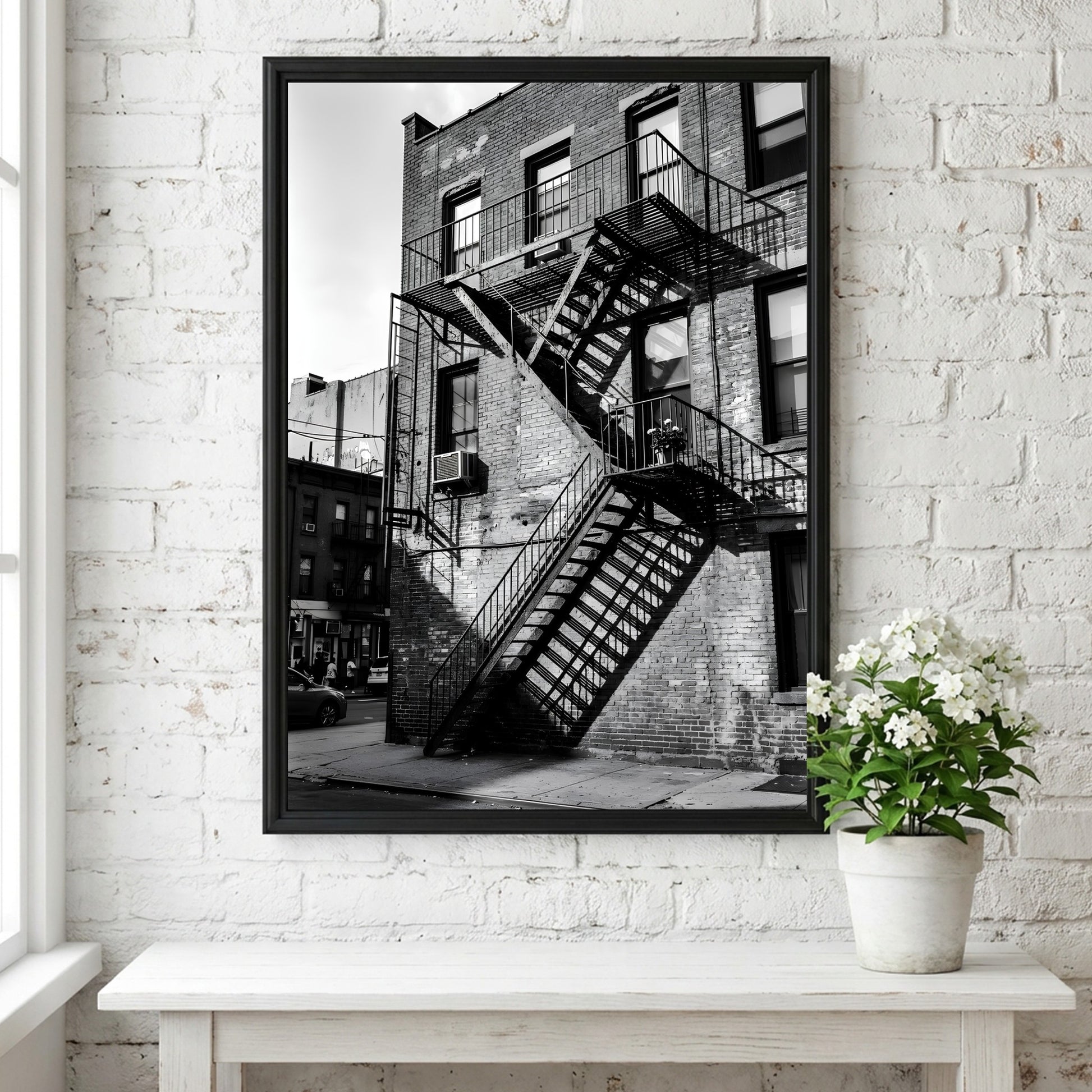 black and white wall decor showing fire escape stairs on brick building with shadows