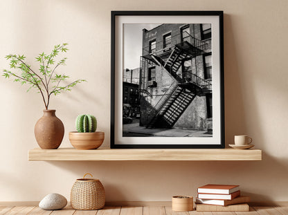 black and white wall decor showing fire escape stairs on brick building with shadows
