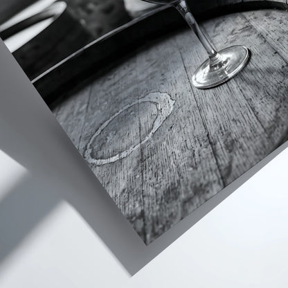 Black and white poster of a glass of wine on wooden barrel with window light shadows
