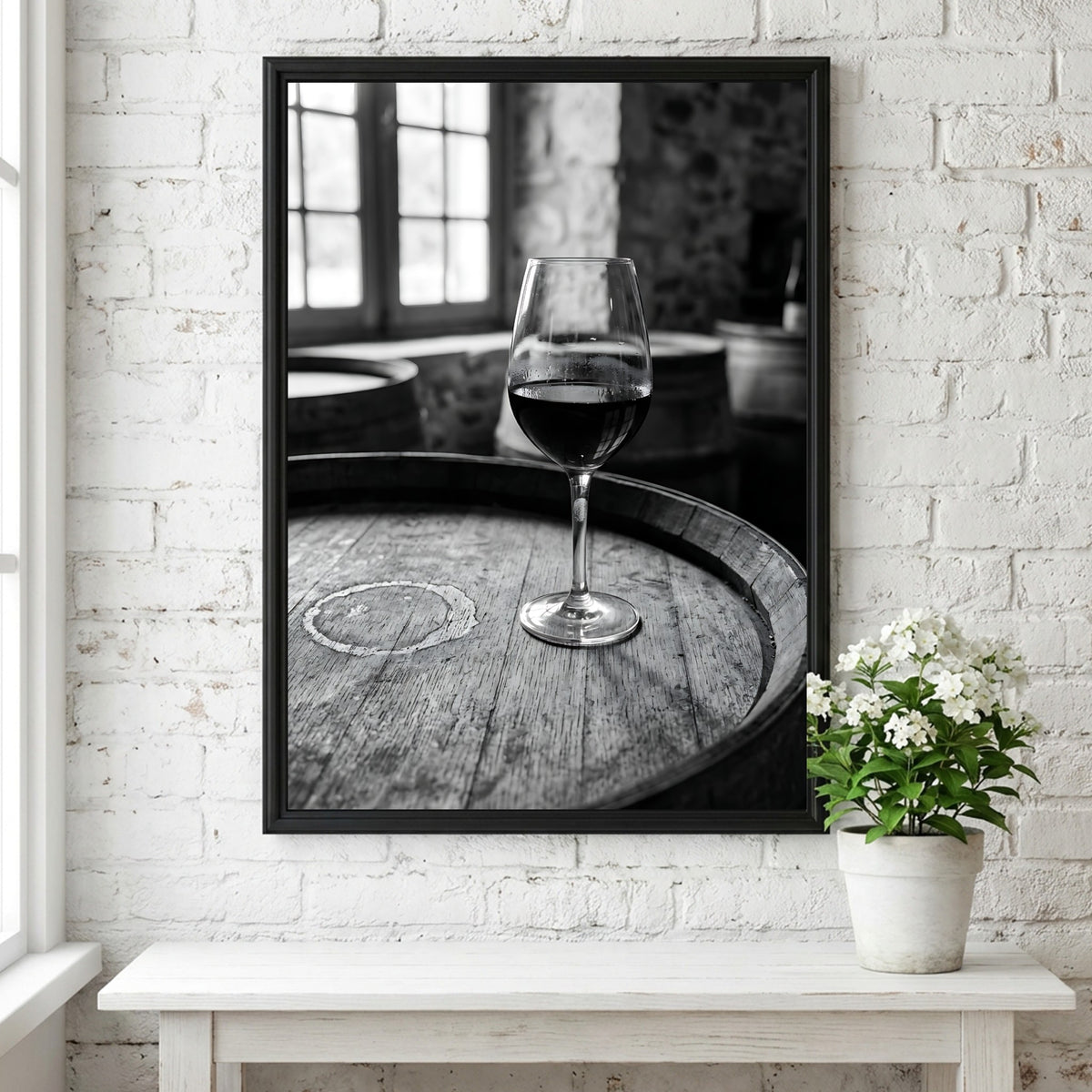 Black and white poster of a glass of wine on wooden barrel with window light shadows