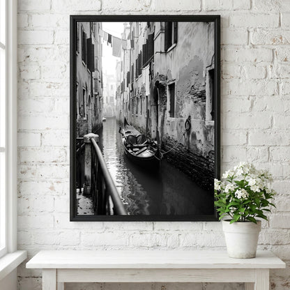 Black and white poster of a gondola moored in a narrow Venetian canal with historic buildings and hanging
