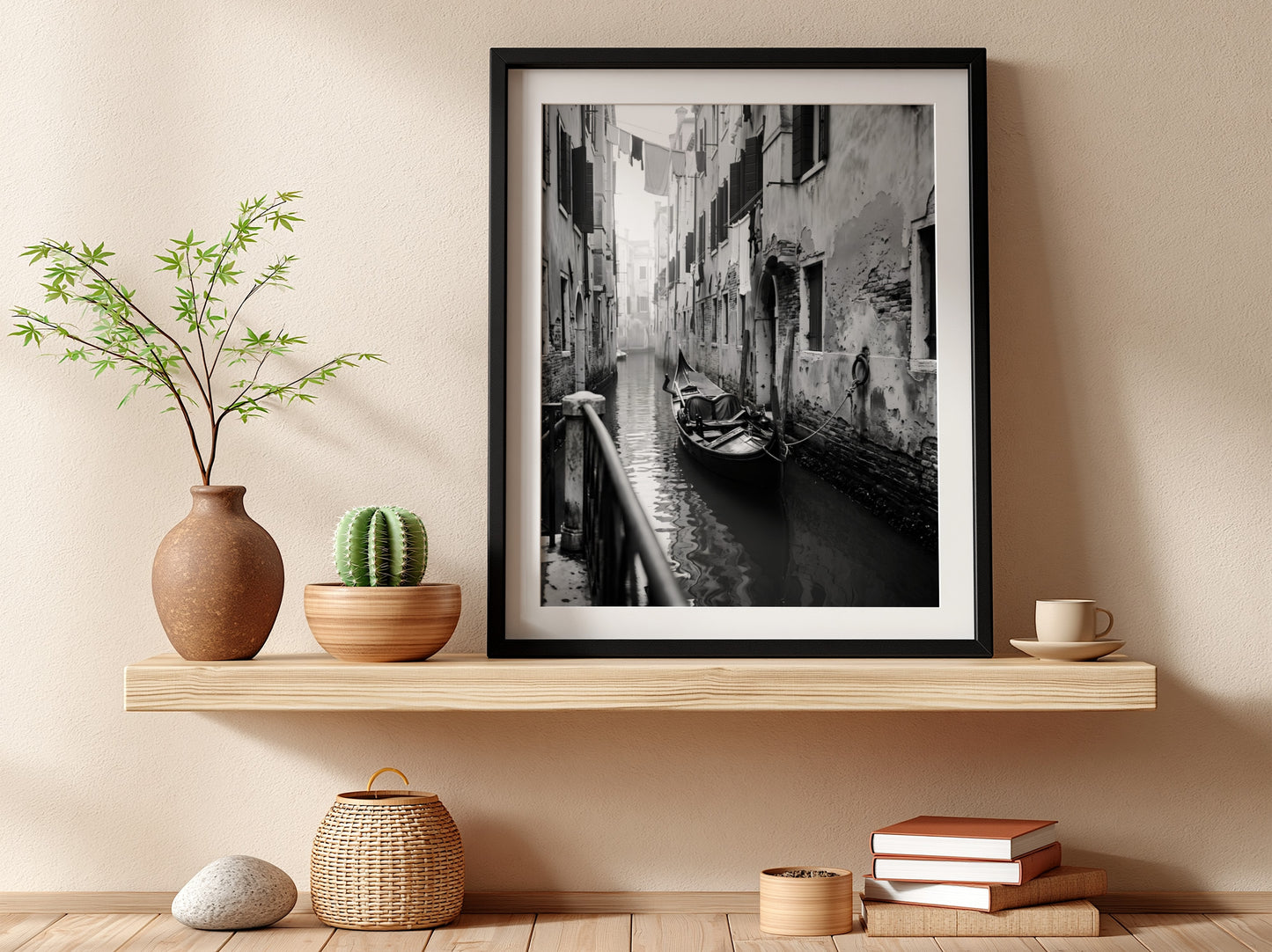 Black and white poster of a gondola moored in a narrow Venetian canal with historic buildings and hanging