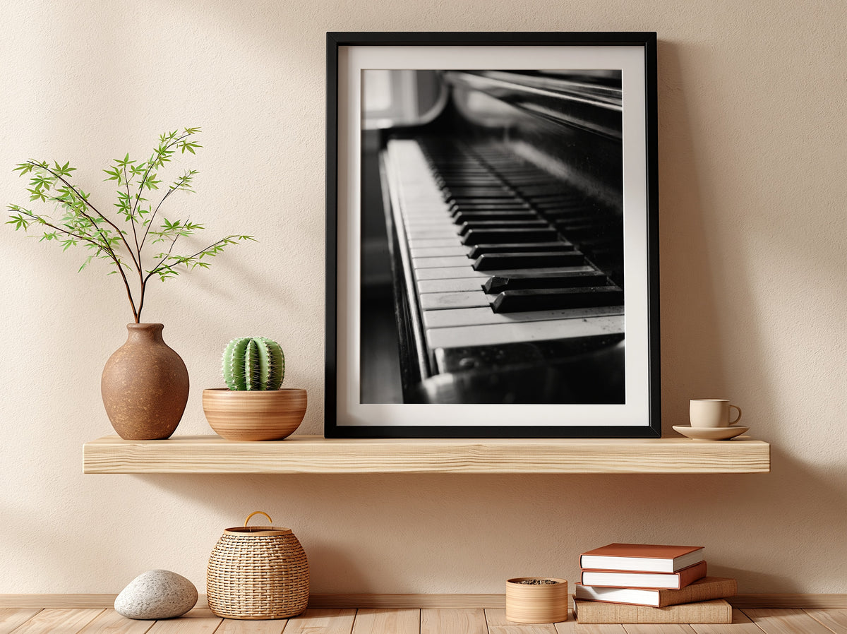 Wall decor showing close-up black and white grand piano keys with glossy finish and reflections