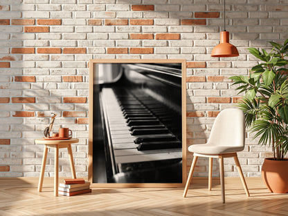 Wall decor showing close-up black and white grand piano keys with glossy finish and reflections