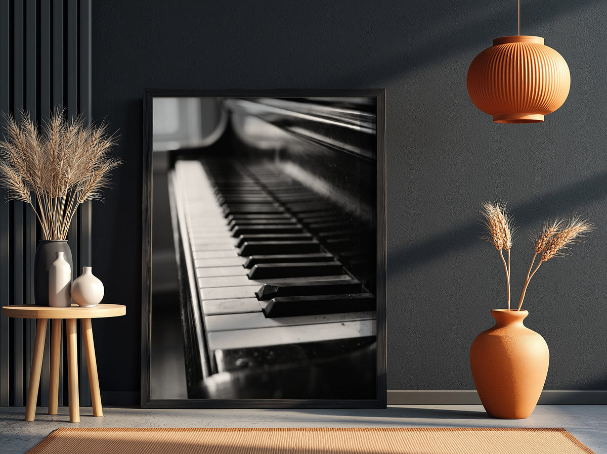 Wall decor showing close-up black and white grand piano keys with glossy finish and reflections