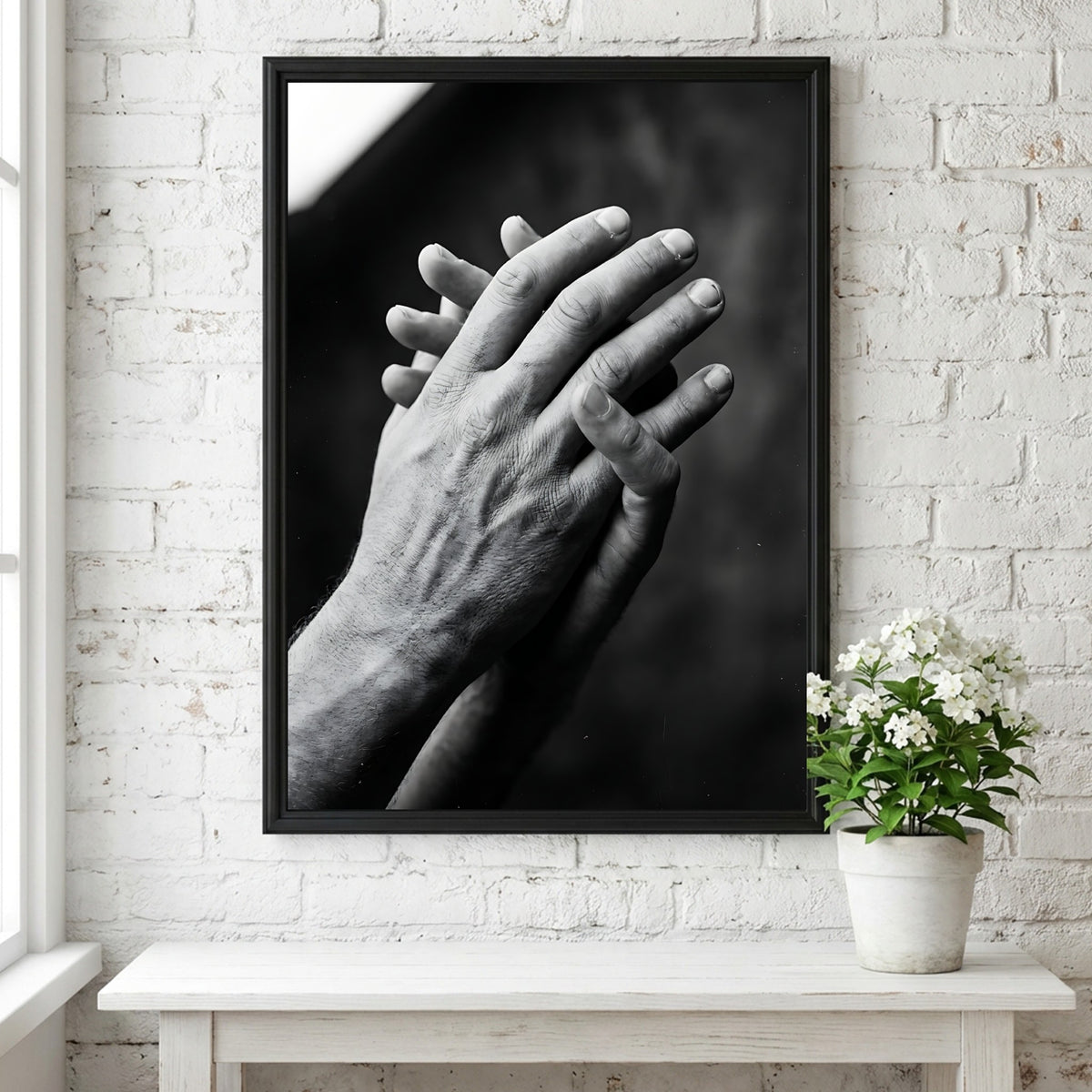 black and white poster featuring expressive hands in detailed monochrome style with textured skin and shadows