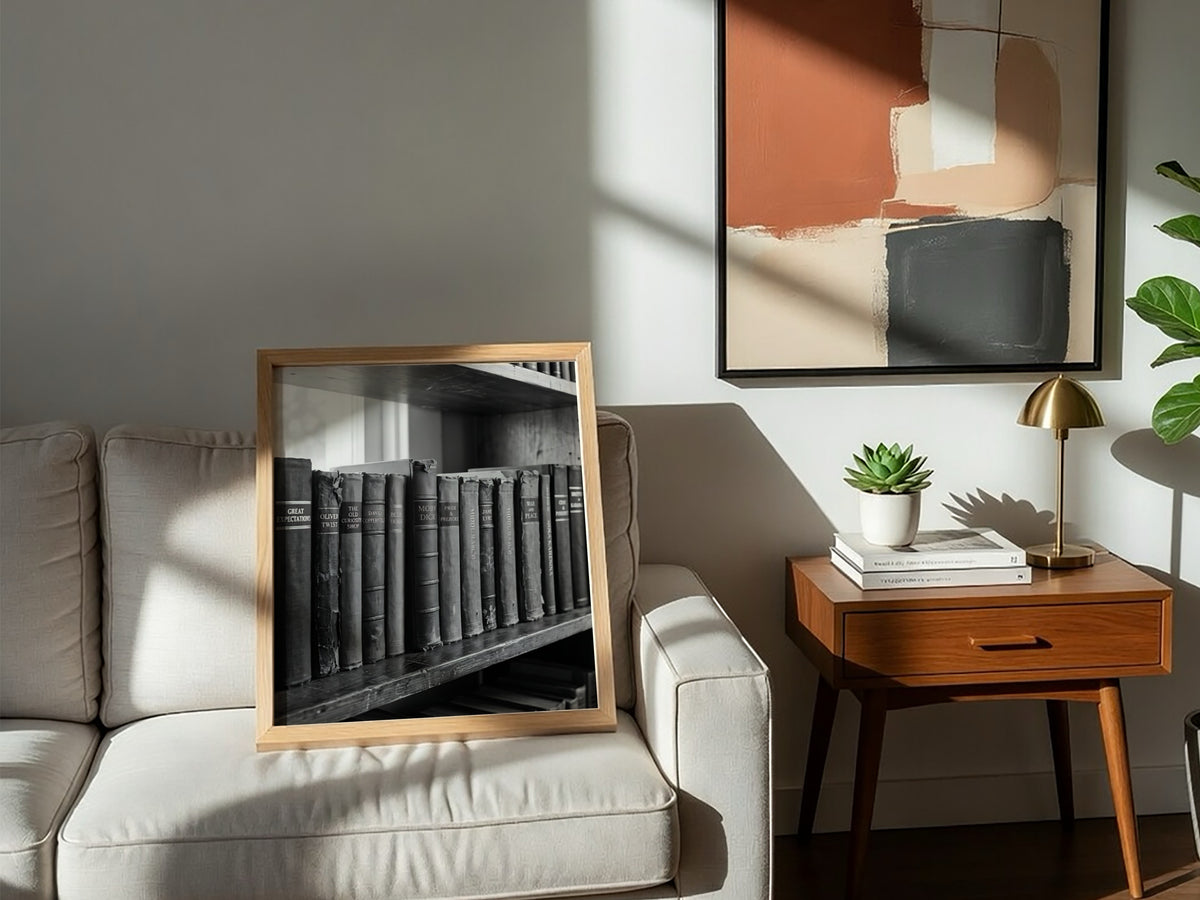Poster showing hardcover book spines on wooden shelf in black and white vintage photographic style