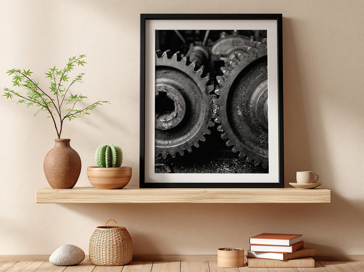 Poster of interlocking industrial gears in monochrome with detailed textured metal surfaces