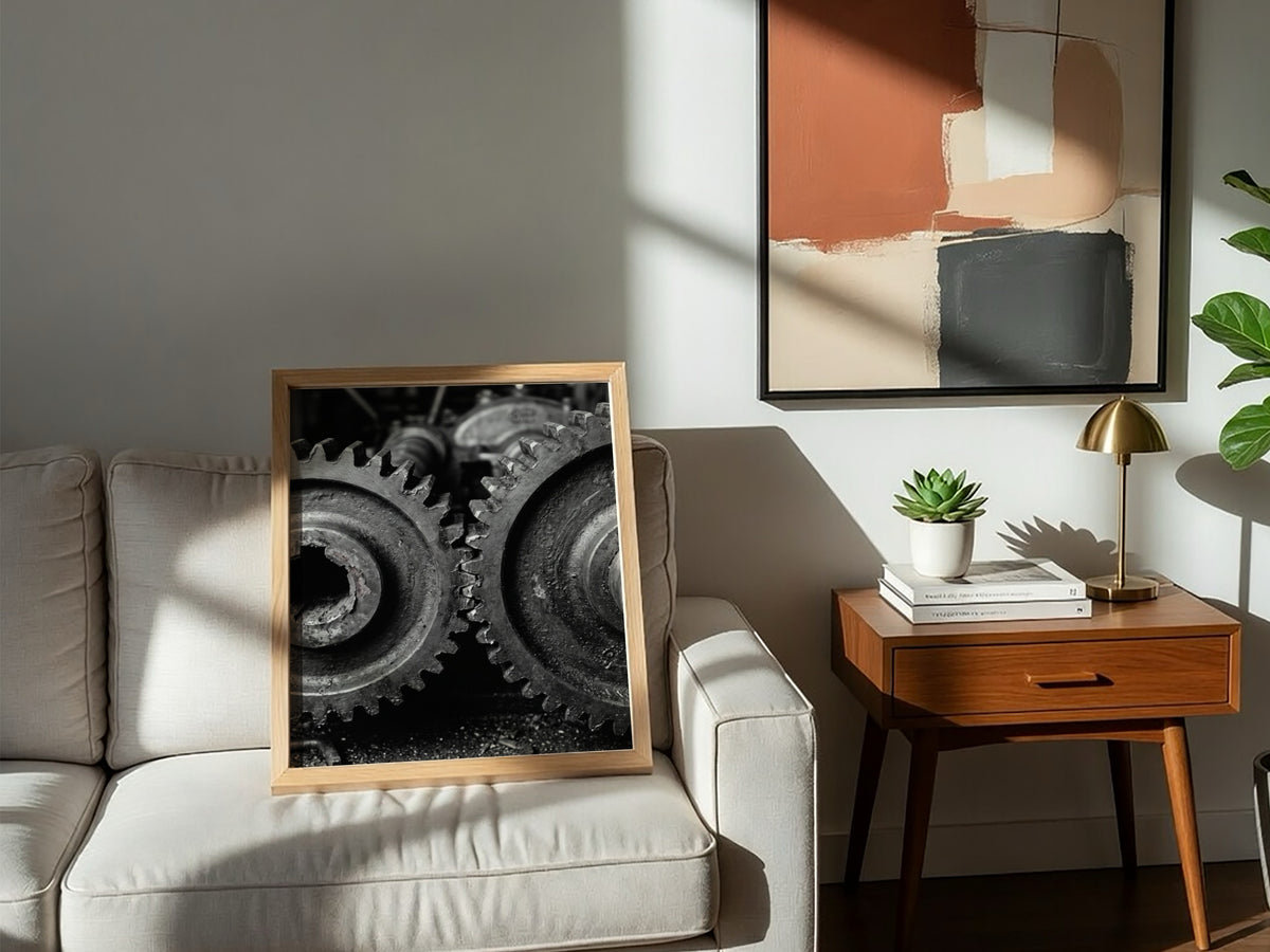 Poster of interlocking industrial gears in monochrome with detailed textured metal surfaces